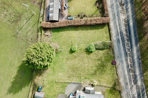 Land, in Mosside Plot, £45,000