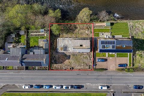 Land, in Plots 1 & 2, £150,000