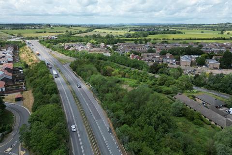 Land, in Land at the Manorway, £20,000