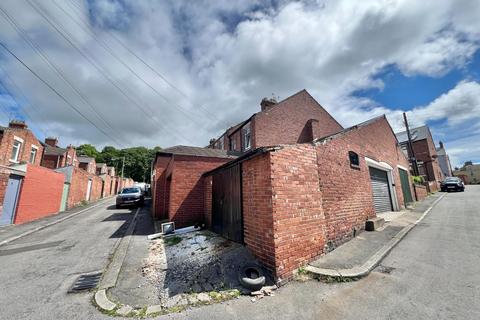 Studio, in Garage at rear of Alexandra Terrace, £15,000