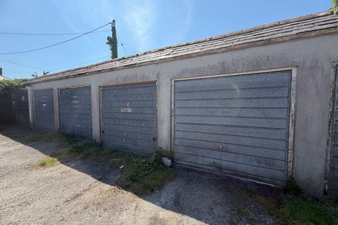 Land, in Garage, £3,000