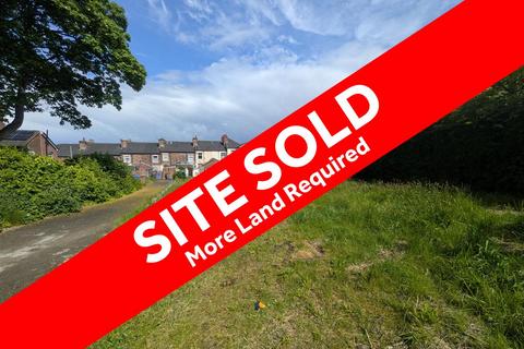 Land, in Tweed Street, £23,000