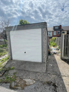Land, in Plot of Land with Garage rear of 12. Elizabeth Street, £50
