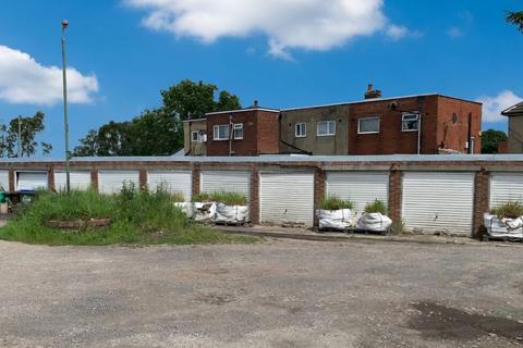 Land, in Twelve Garages At Horsman Street, £25,000