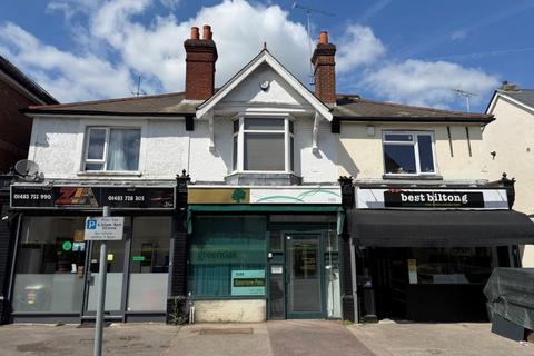 Land, in 155 Goldsworth Road, £200,000