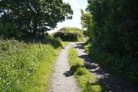 Land, in Woodlands Road, £30,000