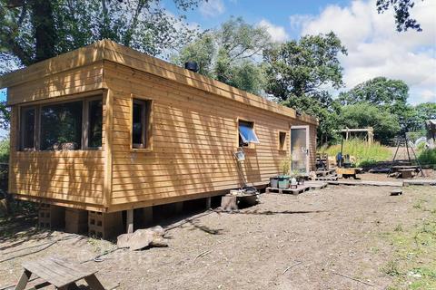 Studio, in Whitehouse Road, £140,000
