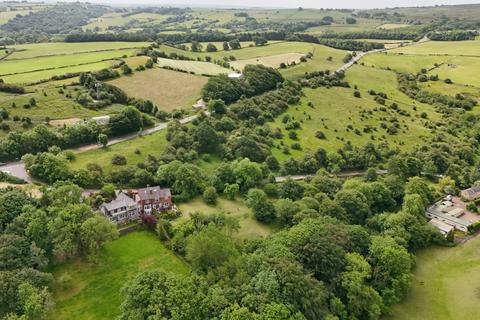 Land, in Lane Head Road, £150,000