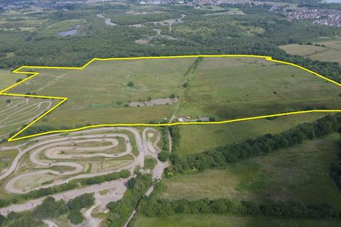 Land, in Park Road, £500,000