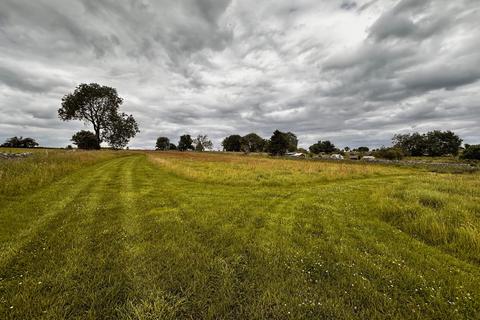 Land, in Monyash Road, £30,000