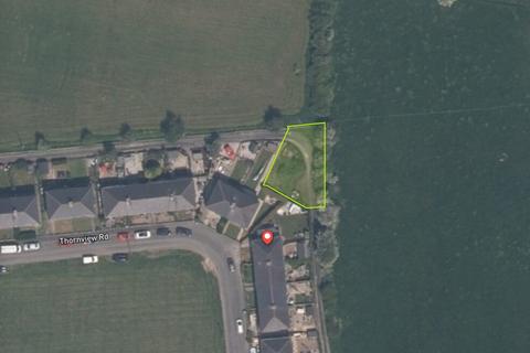 Studio, in Thornview Rd, £15,000