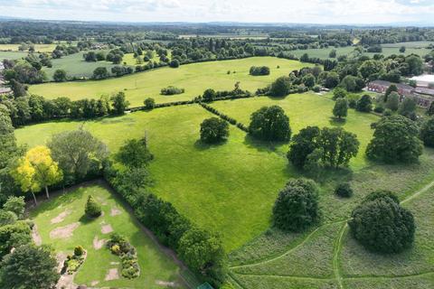 Land, in Hollybush Lane, £15,000