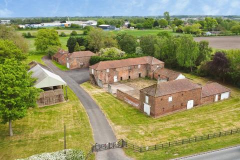Land, in Belton Road, £500,000