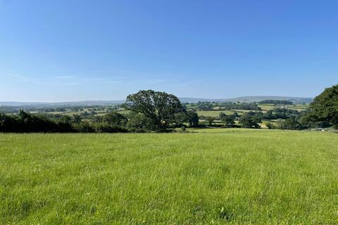 Land, in Ravens Close Brow, £200,000