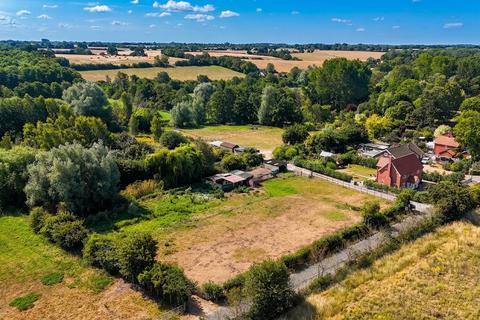 Land, in 68 The Street, £100,000