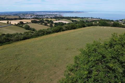 Land, in Higher Holcombe Road, £75,000