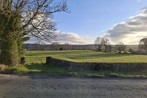 Land, in Westwick Road, £60,000