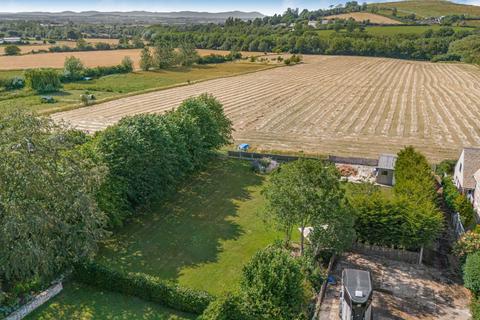 Land, in Gretton Road, £380,000