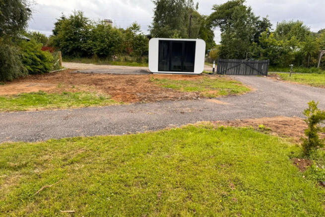 Land, in Black Water Plot With Pod, £16,000