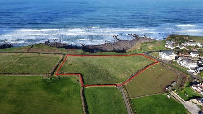 Land, in Marine Drive, £90,000