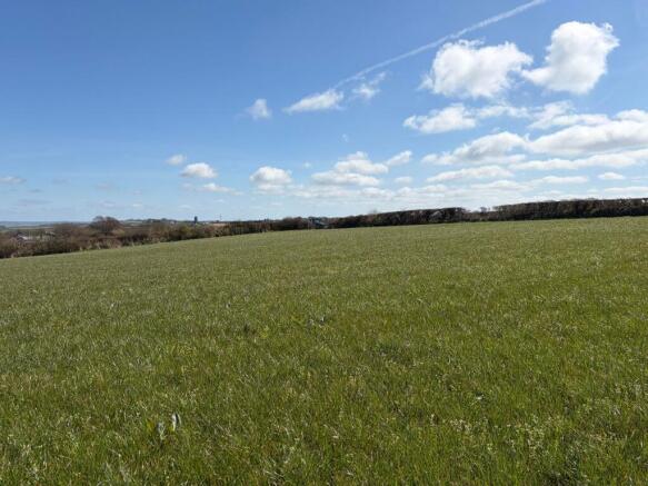 Land, in Parkham, £85,000