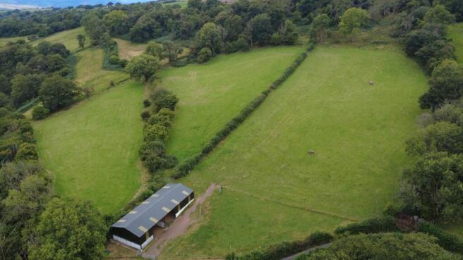 Land, in Approximately 10.75 acres of land and a building at Ystradfellte, £175,000