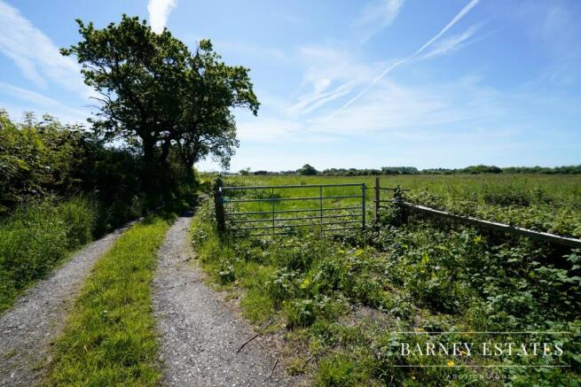 Land, in Woodlands Road, £25,000