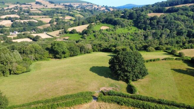 Land, in Approximately 7.67 acres of land at Spring Farm, £75,000