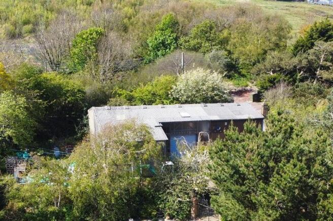 Land, in Warren Road, £450,000