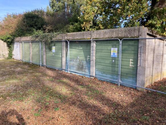 Land, in Garages lying to the East of, £70,000