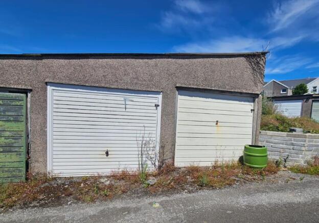 Land, in Garages 11 & 12, £10,000