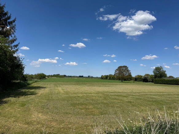 Land, in Smeeth Road, £125,000